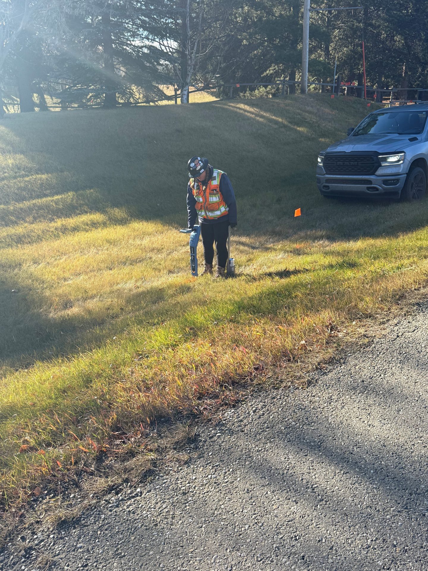 A utility locator working in a field.